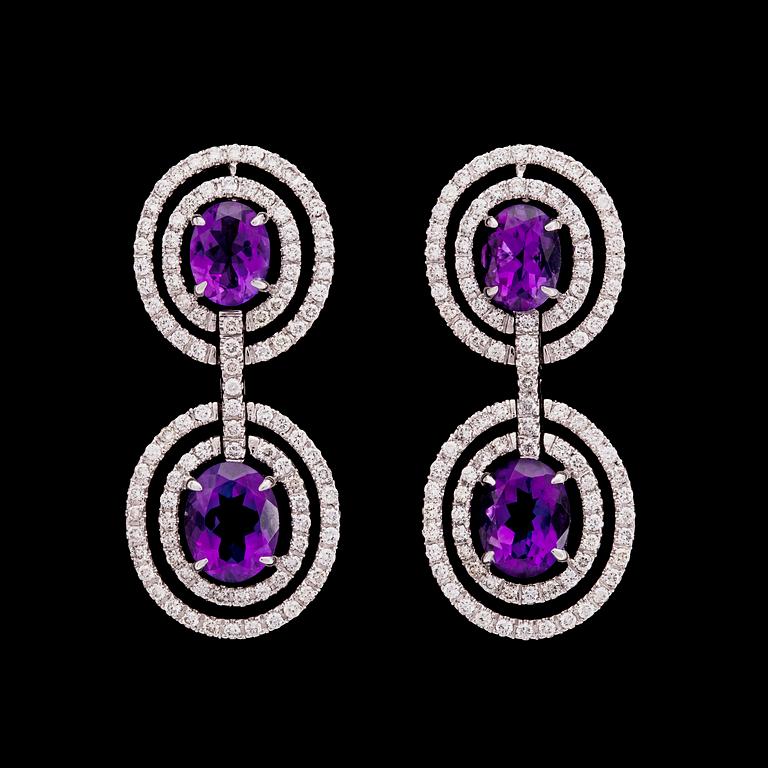 A pair of amethyst and brilliant cut diamond earrings, tot. 1.90 ct.