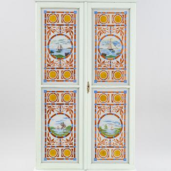 A painted cabinet, circa 1900.