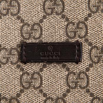 Gucci, a canvas tote bag.