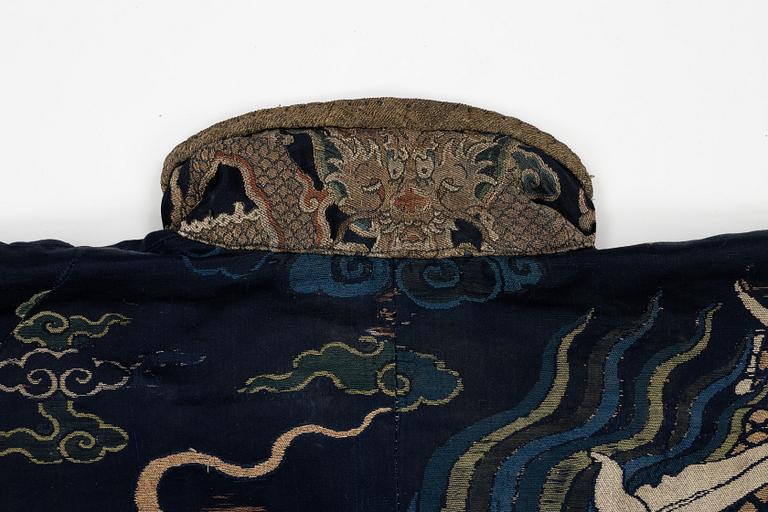 A rare fragment of a silk four clawed 'dragon' jacket, late Ming dynasty/early Qing dynasty.