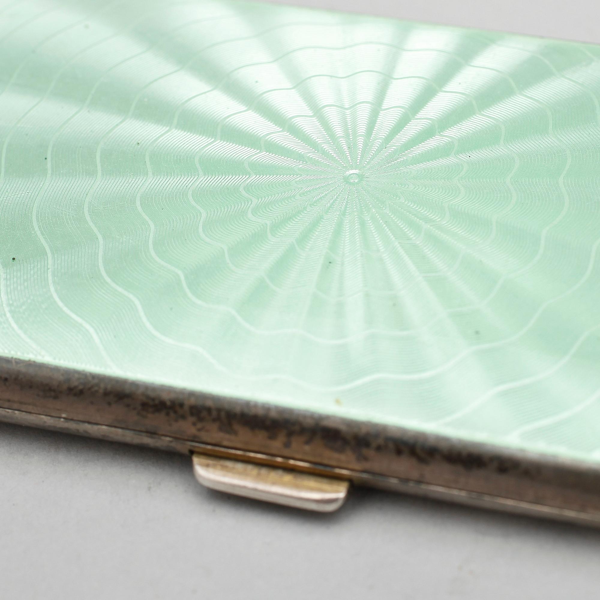 CIGARETTETUIER, 3 st, silver samt emalj Tyskland, 1900-tal. Totalvikt ca 288 gram.