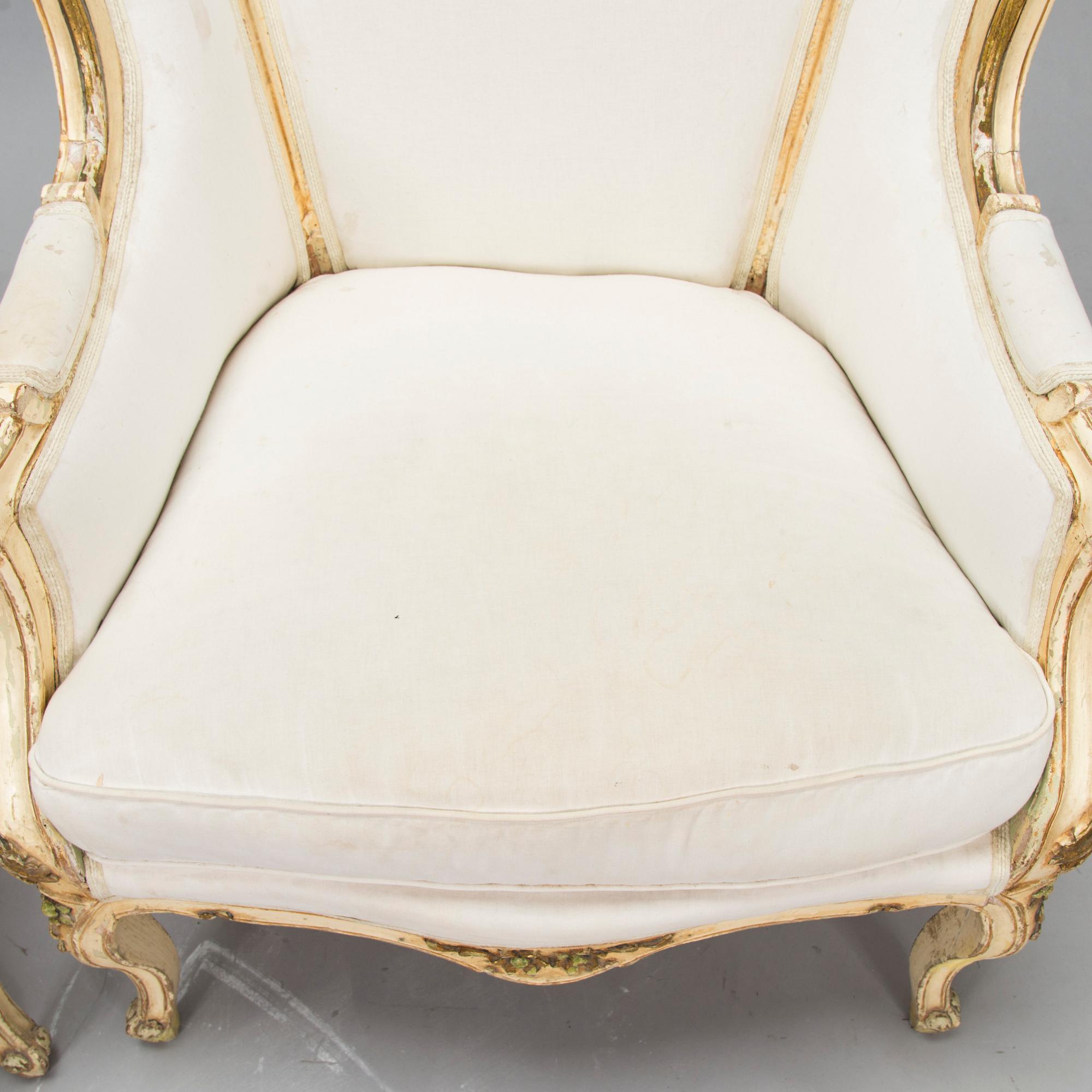 A pair of louis quinze style bergerer armchairs, first part of the 20th century.