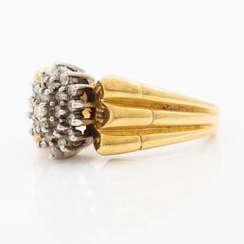 18K gold ring with diamonds.