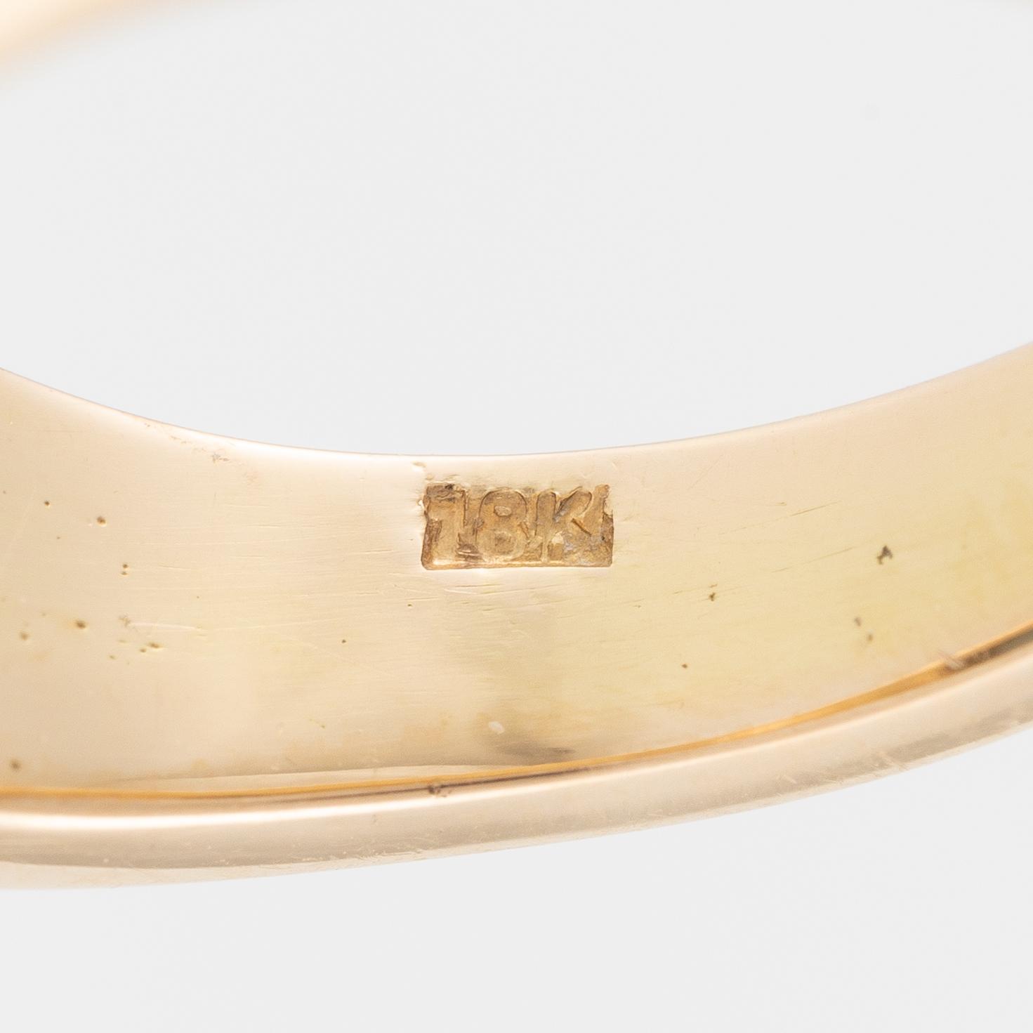 Ring, 18K gold with blue topaz.