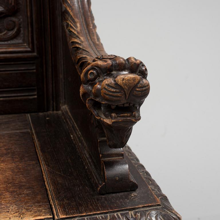 A oak Baroque style bench from around year 1900.