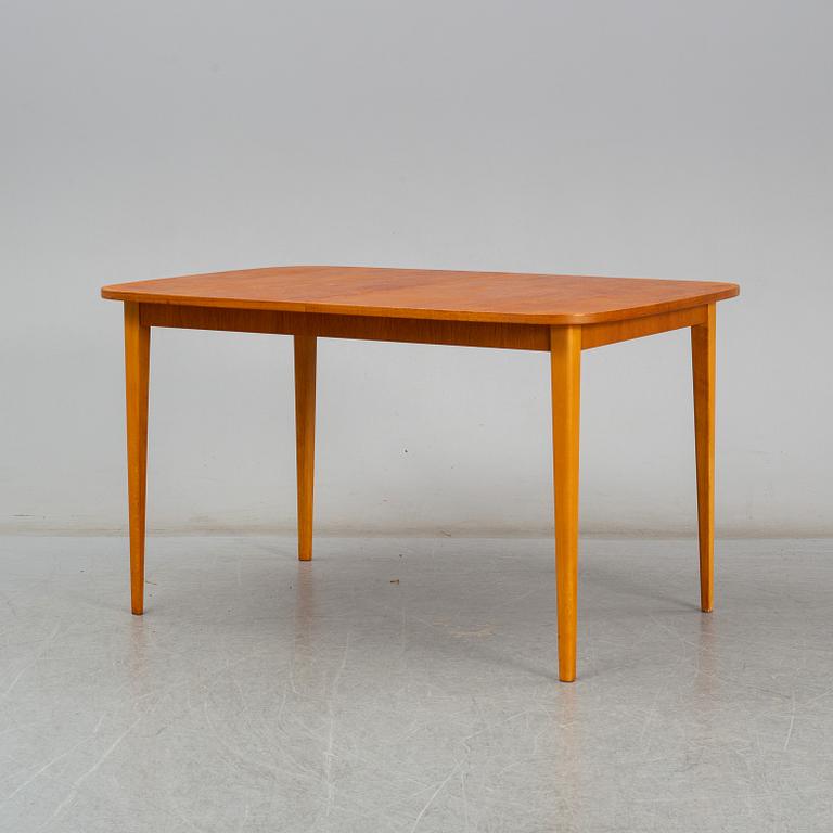 A second half of the 20th century teak veneered dining table.