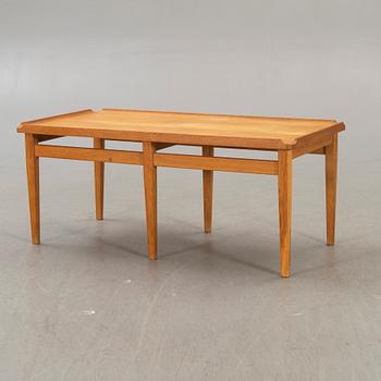 A 1960s oak coffee table.
