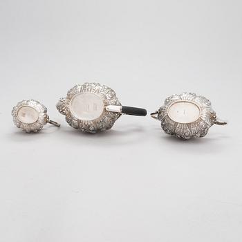 An English 3-piece sterling silver tea set, maker's mark of William Comyns & Sons, London 1892.