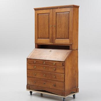 An oak writing cabinet, around 1800.