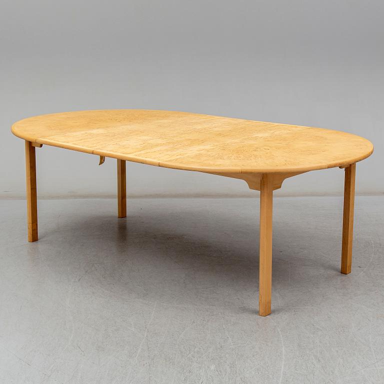 a 'Svitjod' dining table by Göran Malmvall for Karl Andersson & söner.