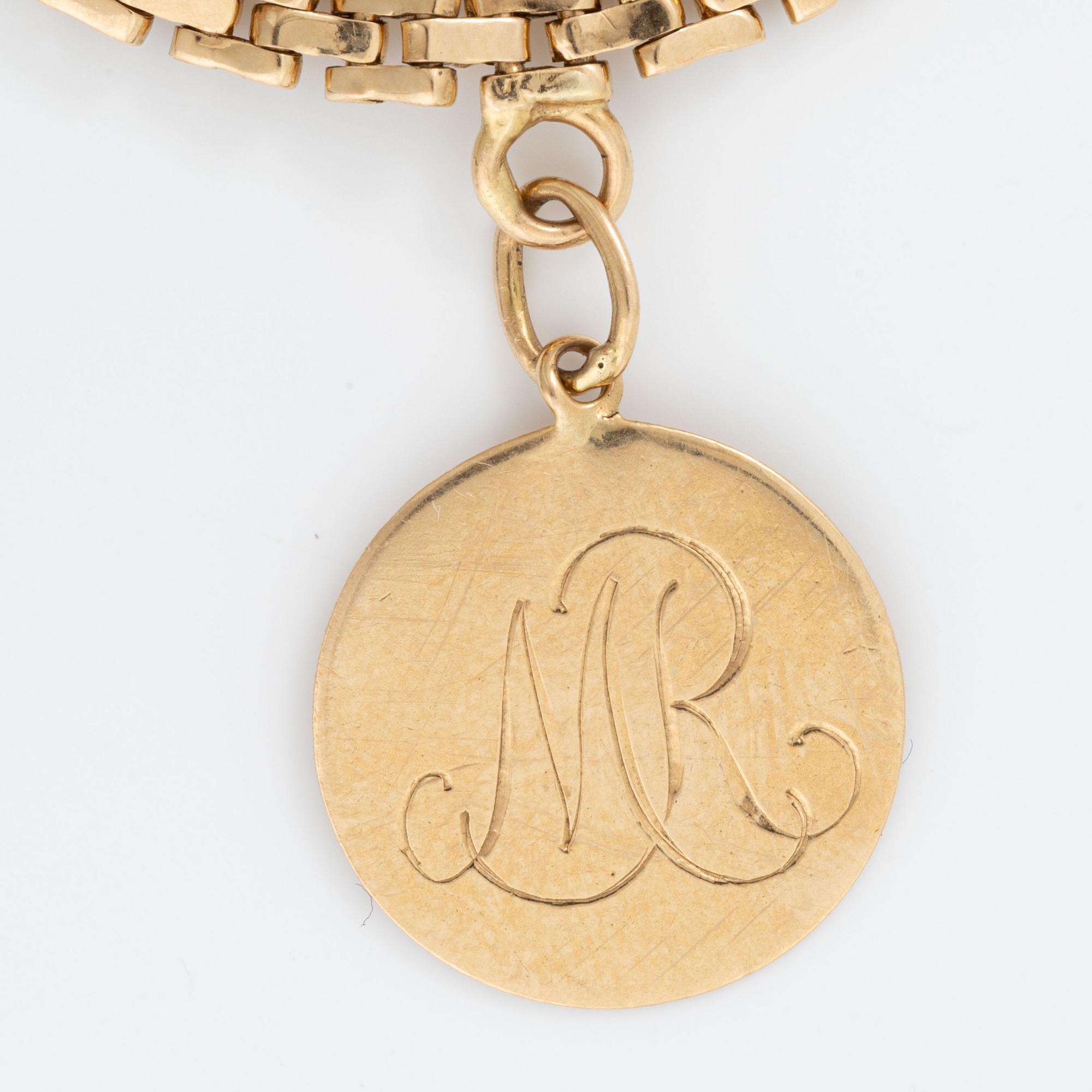 Armband med berlocker guld 18K guld.