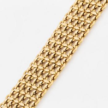 A Cartier 18K gold bracelet.