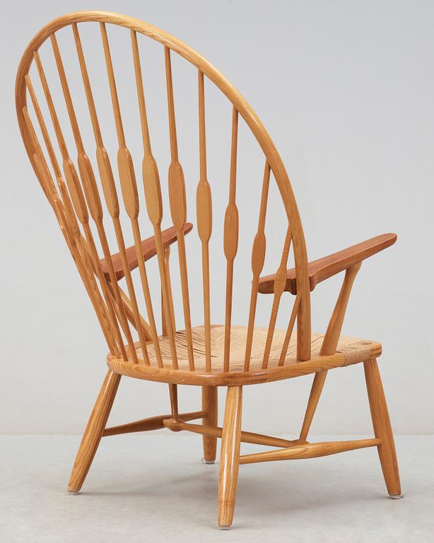 A Hans J Wegner ash and teak 'Peacock chair', Johannes Hansen, Denmark.