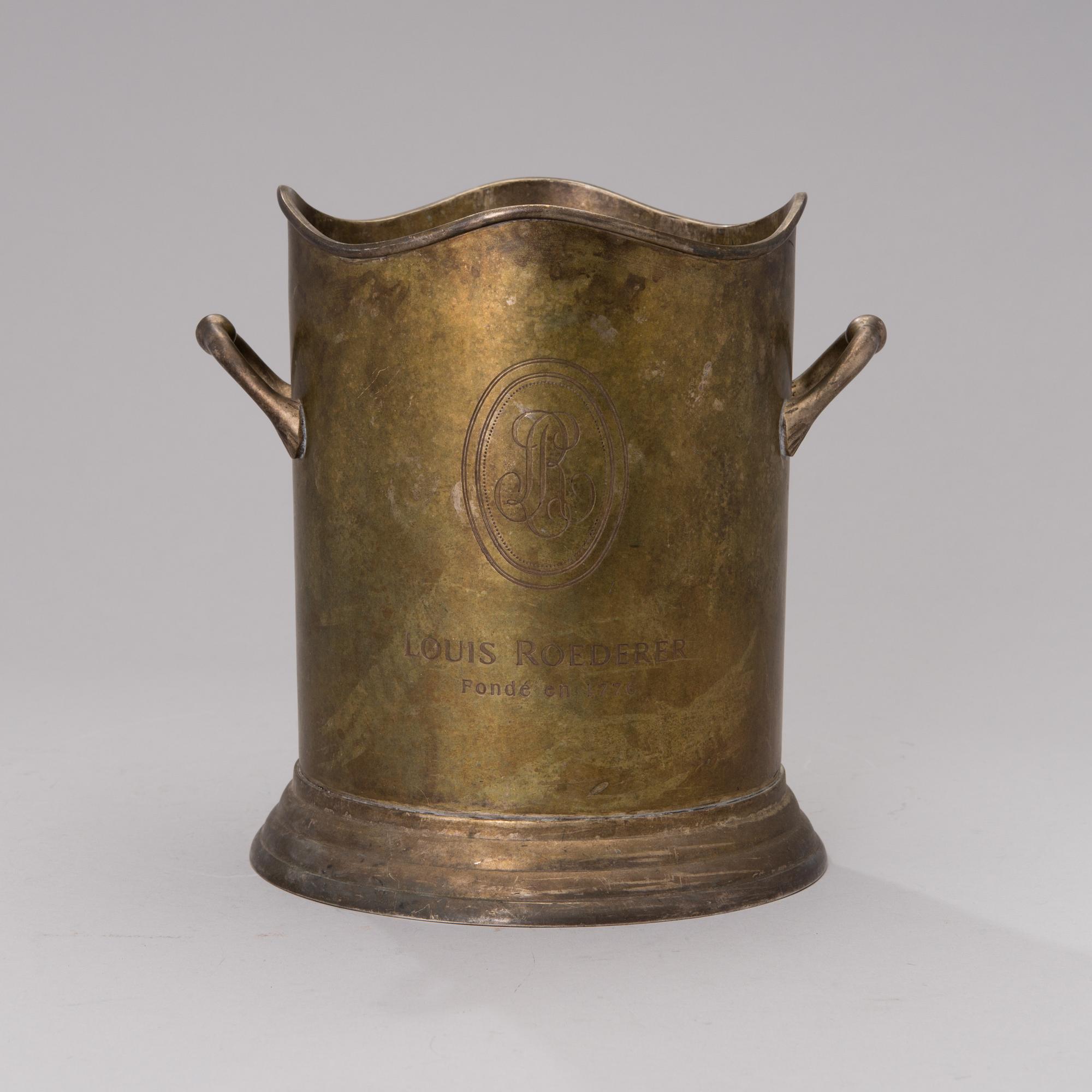 A Louis Roederer champagne cooler of silver plated brass.