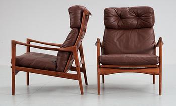 A pair of Ib Kofod Larsen teak and brown leather easy chairs, OPE Möbler, Sweden 1960's.