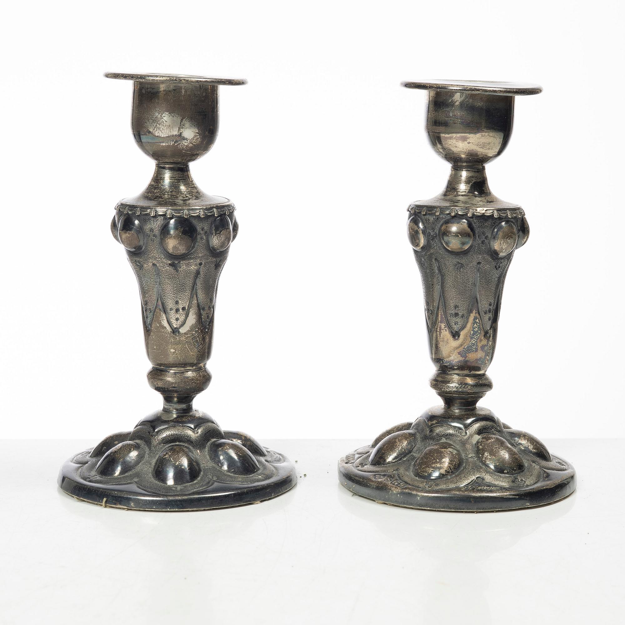 Four pairs och Swedish silver candlesticks, 19th-20th century.