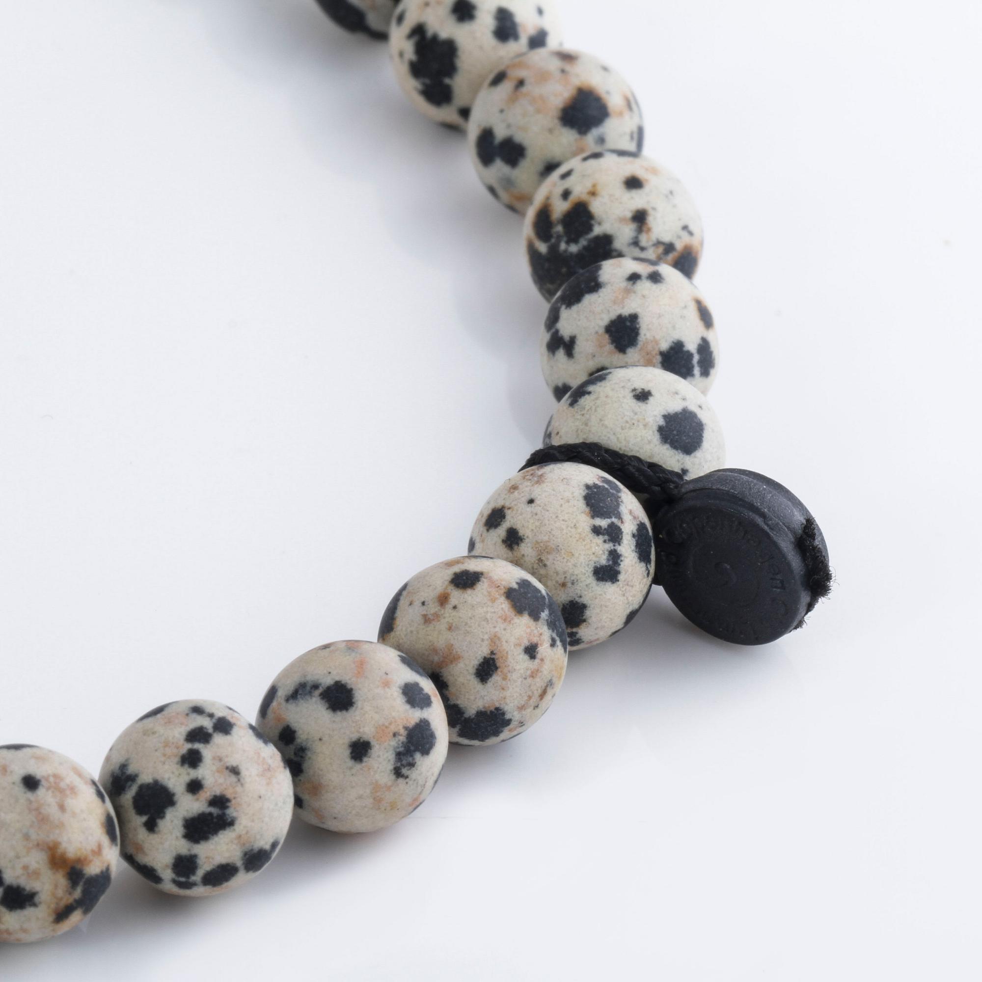 A necklace and clasp with briliant cut diamonds by Ole Lynggaard.