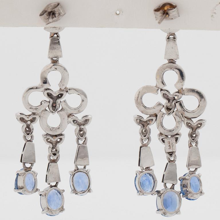 A pair of sapphire and brilliant cut diamond earrings. Mandelstam 'Stardust Shuttle'.