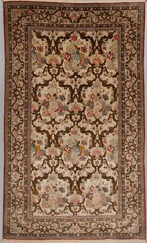 A silk Qum rug, around 220 x 134 cm.