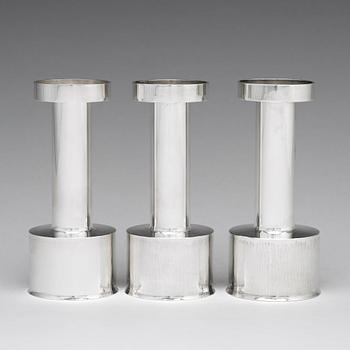 Sigurd Persson, a set of three sterling silver candlesticks, Stockholm 1965 and 1970, executed by Johann Wist.