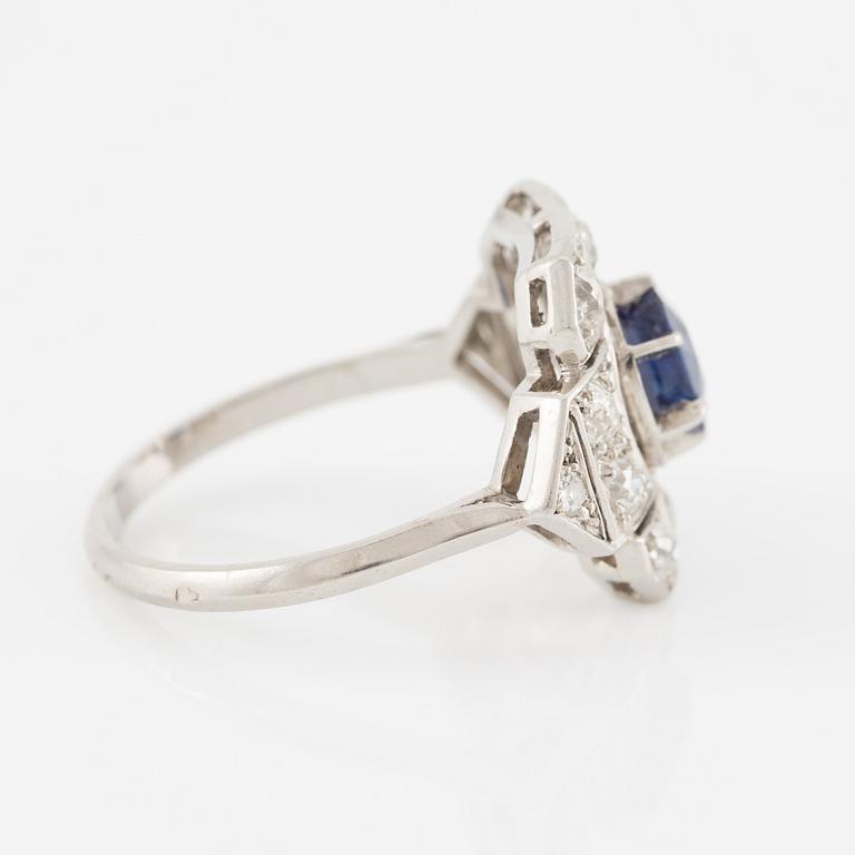 Platinum ring with sapphire and old-cut diamonds.