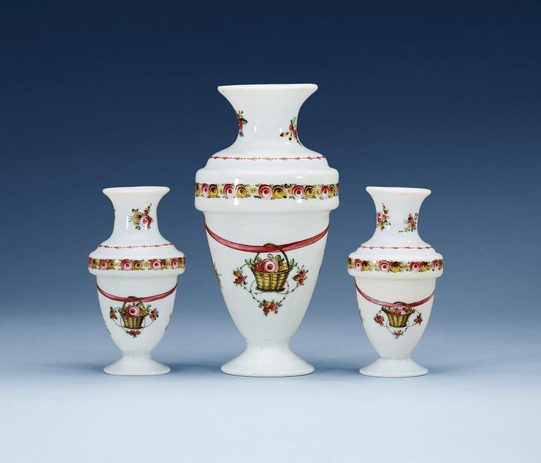 A set of three opaline glass vases, 19th Century, presumably Russian.