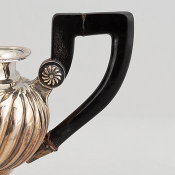 A mixed lot of two 19th century silver and parcel-gilt creamers and a coffee-pot.