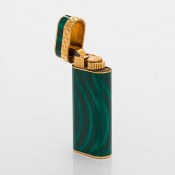 Cartier, A gilded and laquered metal lighter. Marked Cartier, Paris, 6846 X, Swiss made.