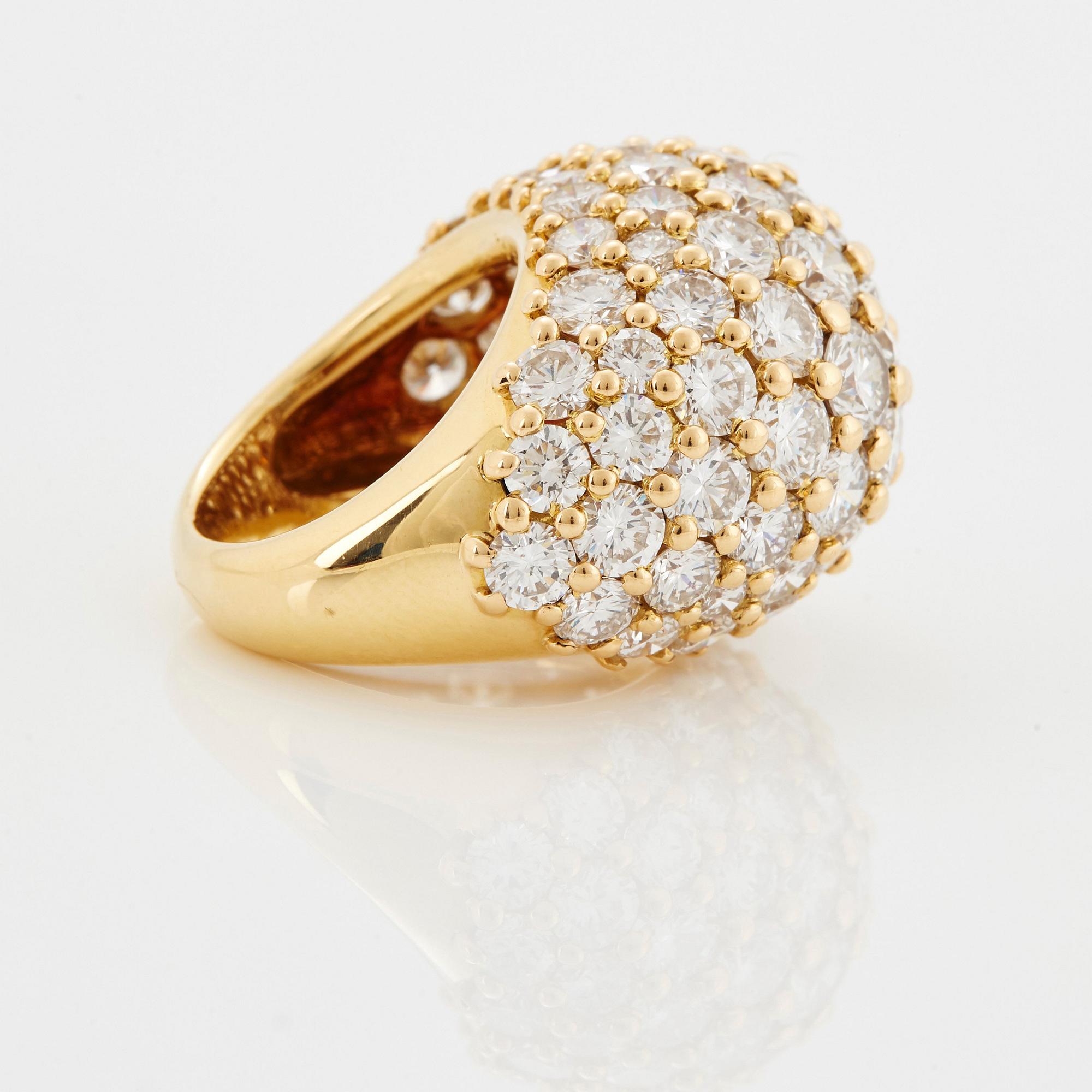 Cartier "Marrakech" an 18K gold bombé ring set with round brilliant-cut diamonds.