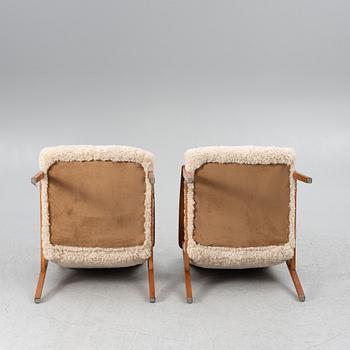 A pair of armchairs, mid-20th century.
