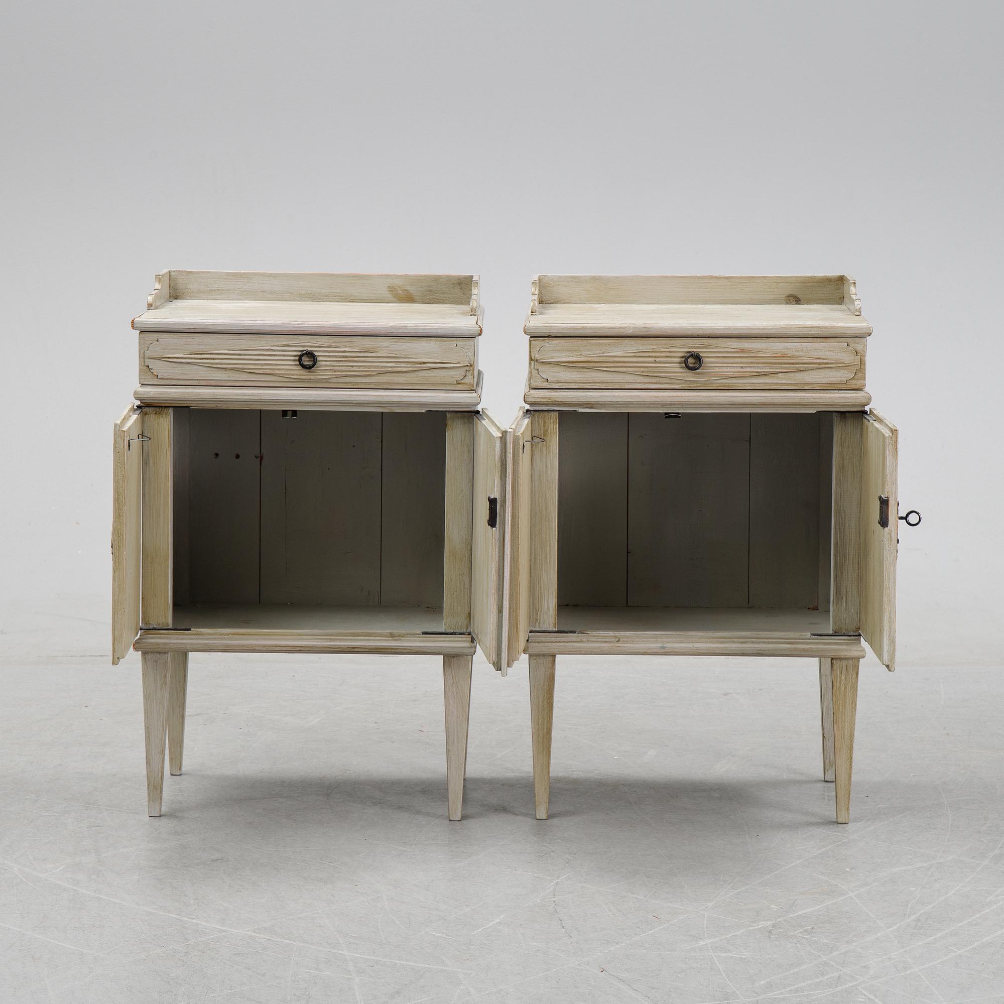A pair of Gustavian style bedside tables, first half of the 20th century,.