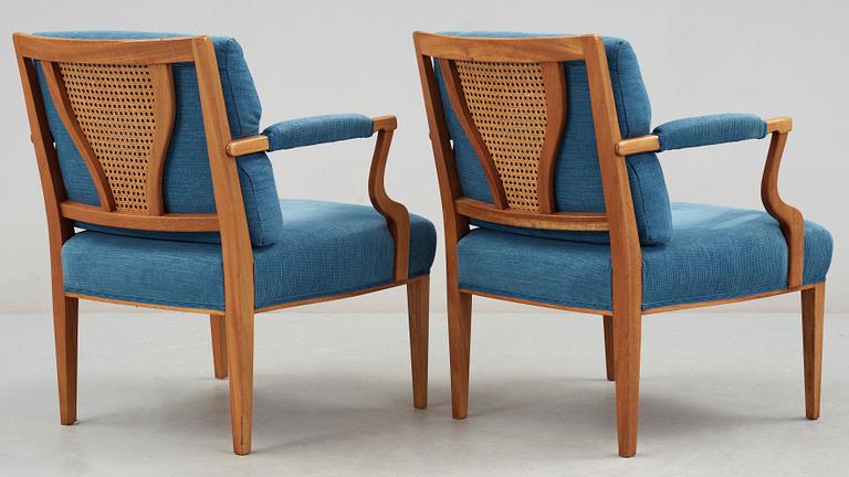 A pair of Josef Frank mahogany, ratten and blue fabric armchairs, Svenskt Tenn, model 969.