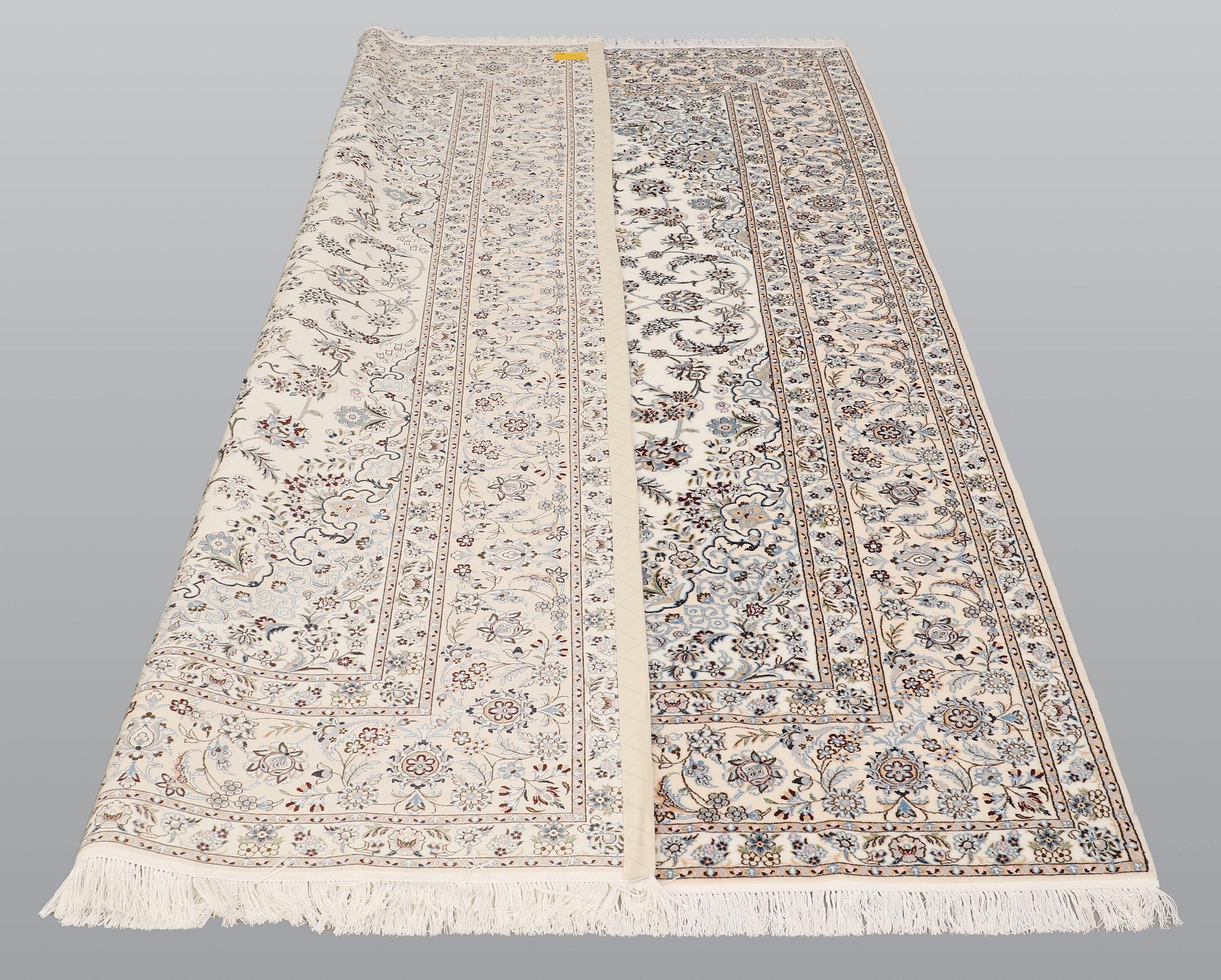 A carpet, Nain part silk s.k 6LAA, ca 310 X 209 cm.