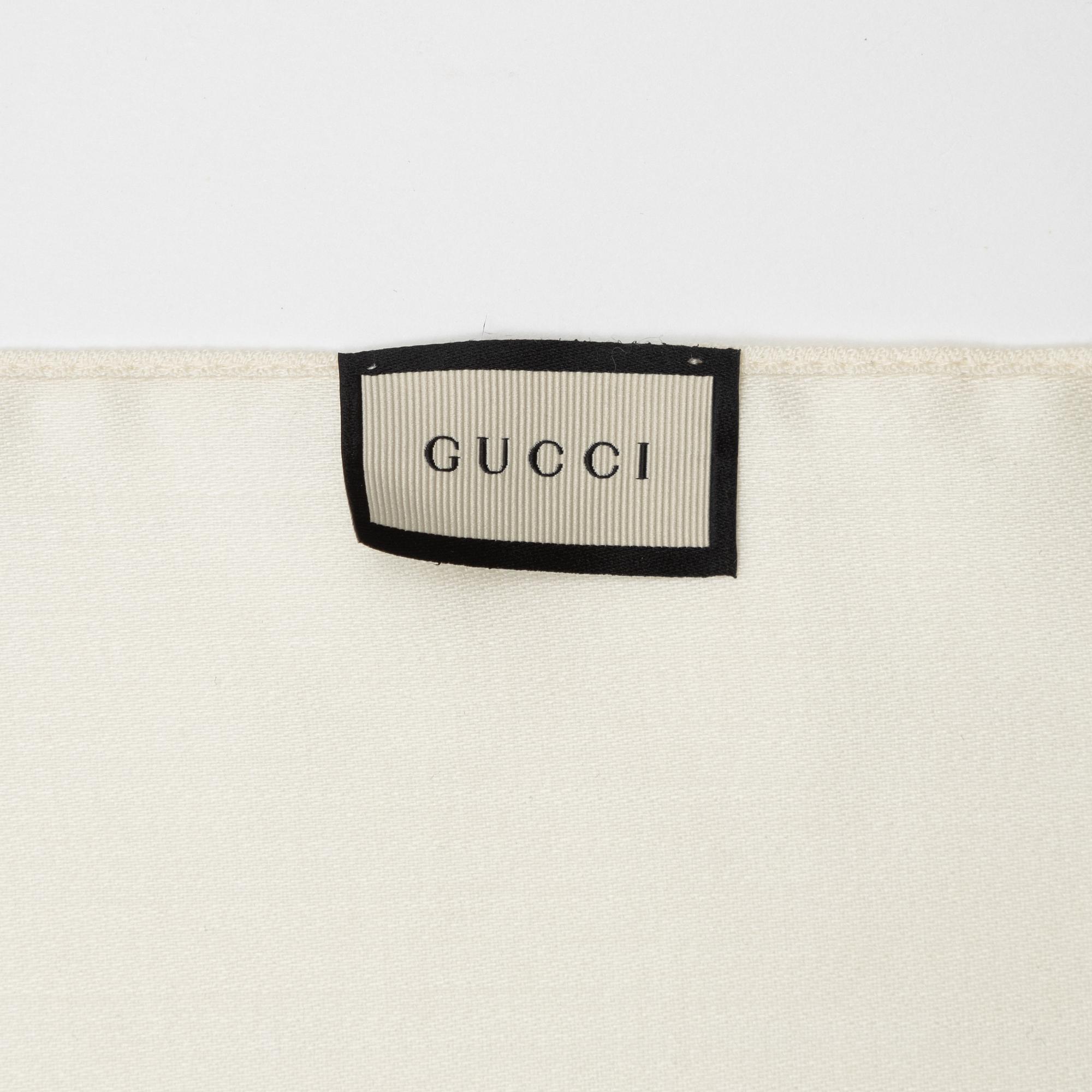 Gucci, a wool and silk mix "GG" jaquard shawl.