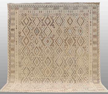 A CARPET, kilim, around 389 x 332 cm.