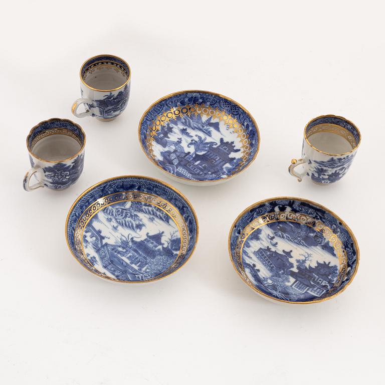 A set of nine gilt and blue and white cups with saucers, Qing dynasty, Qianlong (1736-95).