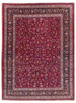 427. A Mashad carpet, signed Saber, c. 402 x 299 cm.