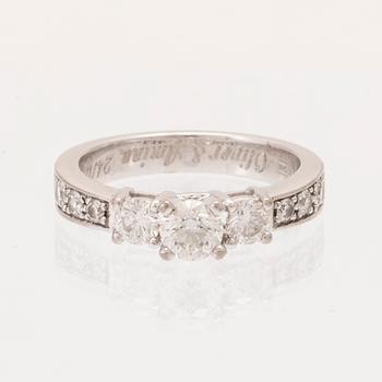 An 18K white gold ring set with round brilliant cut diamonds.