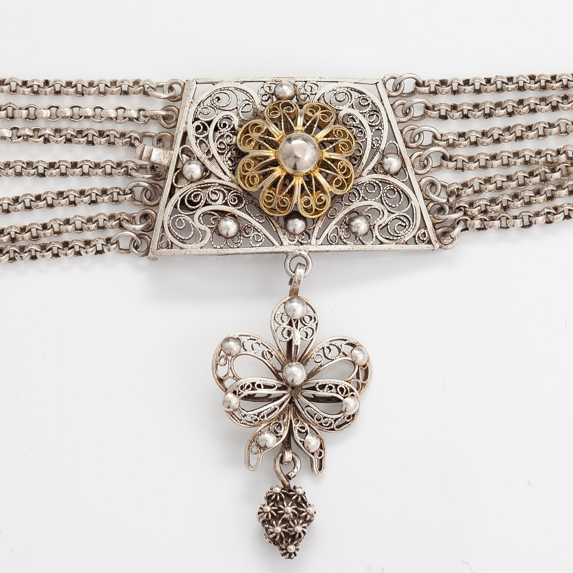 A silver necklace.