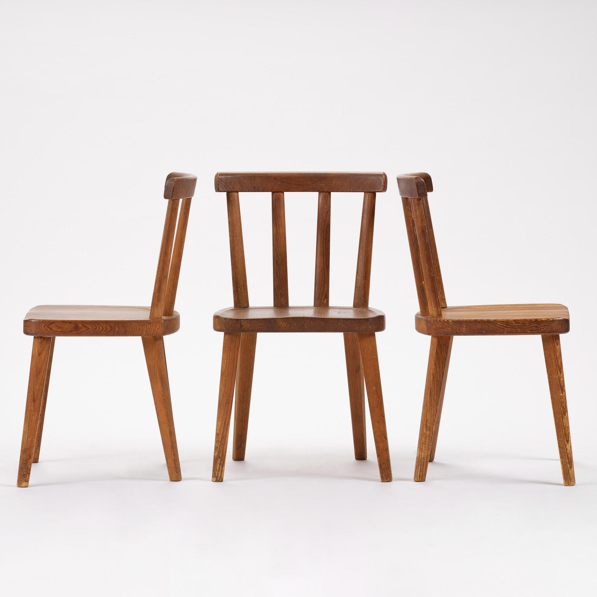 Axel Einar Hjorth, a set of three stained pine "Utö" chairs, Nordiska Kompaniet, Sweden, 1930s.