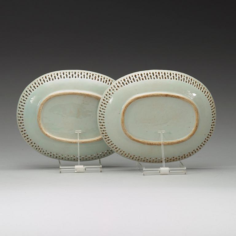 A pair of oval famille rose dishes with figural motifs, Qing dynasty, circa 1800.