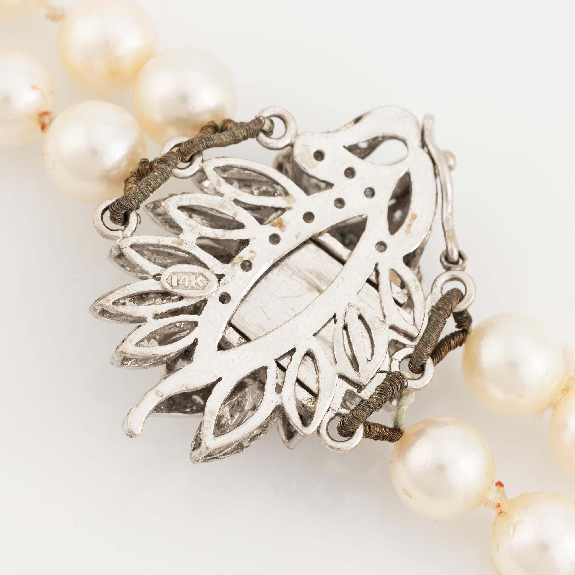 Two strand cultured pearl necklace, clasp with diamonds.