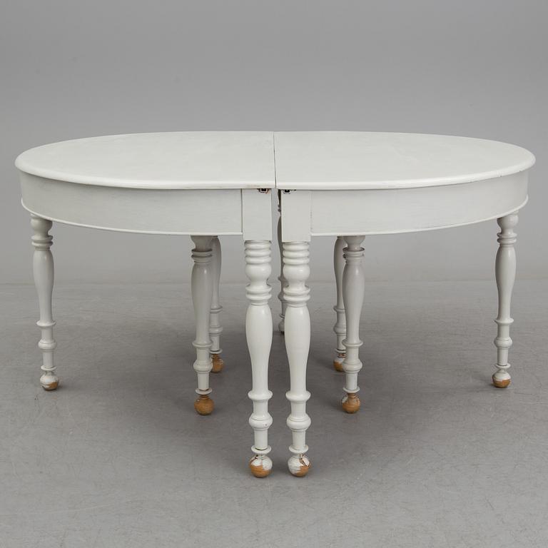 A mid 19th century dining table with six extension leaves.