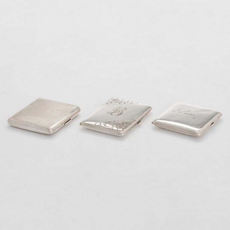 Three silver cigarette cases, incl. Nussbaum & Hunold and EL Weimann.