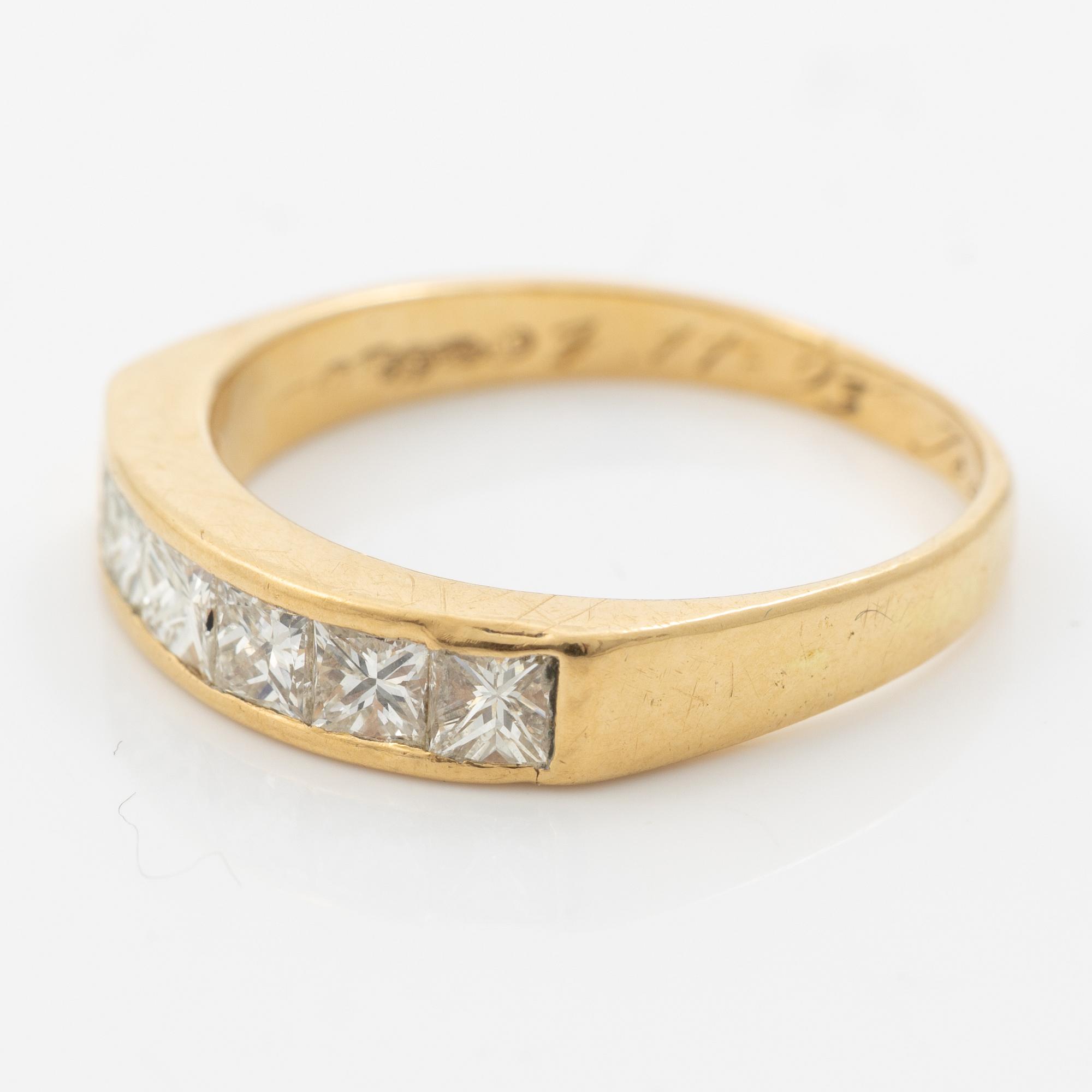 14K gold ring with princess-cut diamonds.