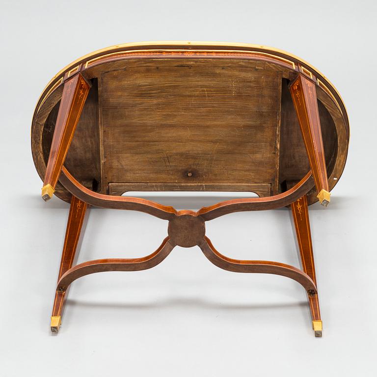 A Directoire style marquetry table from around year 1900.