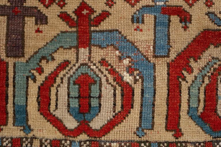 A rug, antique Anatolian/Caucasian, ca 148-149 x 104,5-110 cm (as well as 1-1,5 cm flat weave at one end).