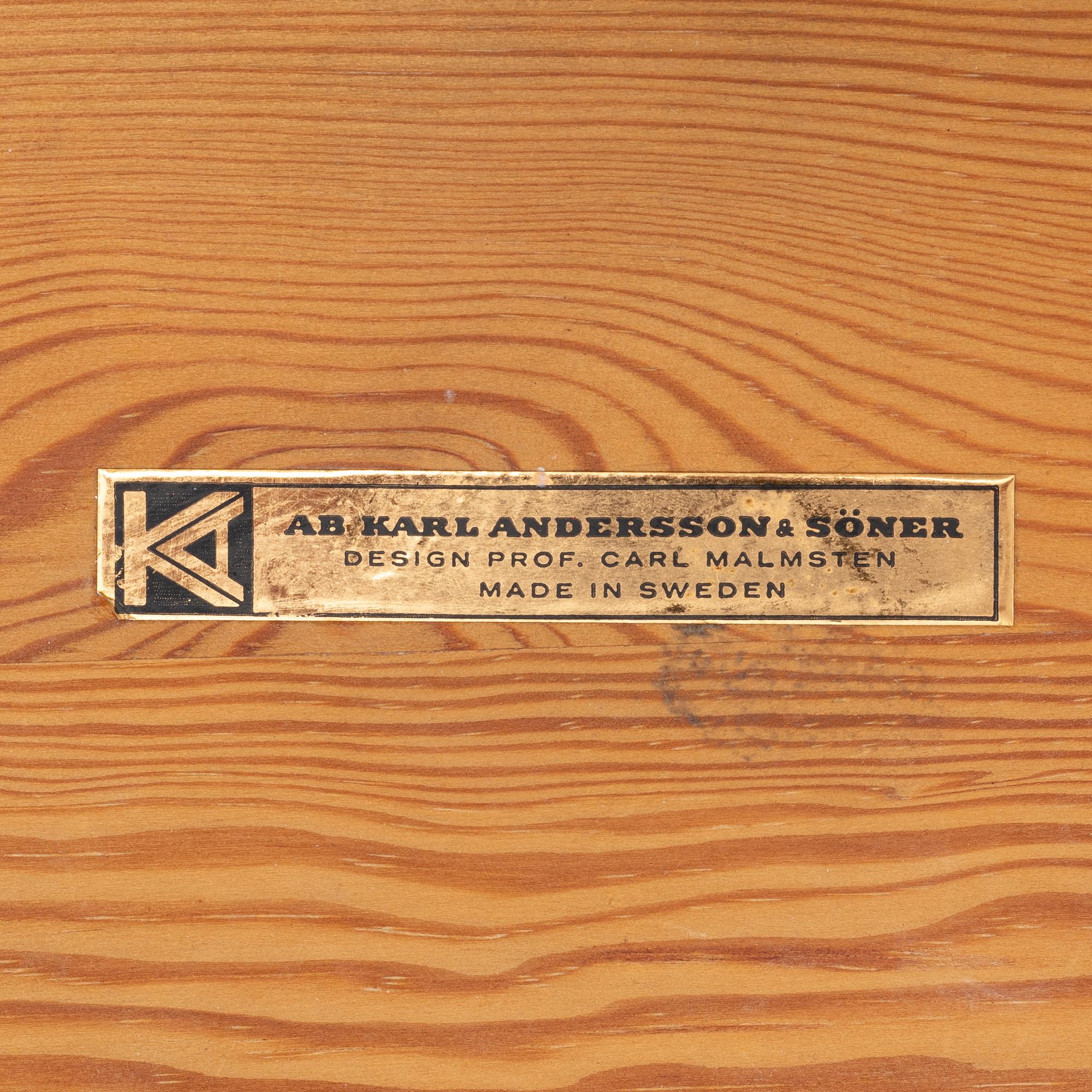 A pine stool by Carl Malmsten for Karl Andersson.