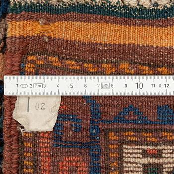 Rug, likely Kurdish, circa 1900, approximately 314 x 156 cm.