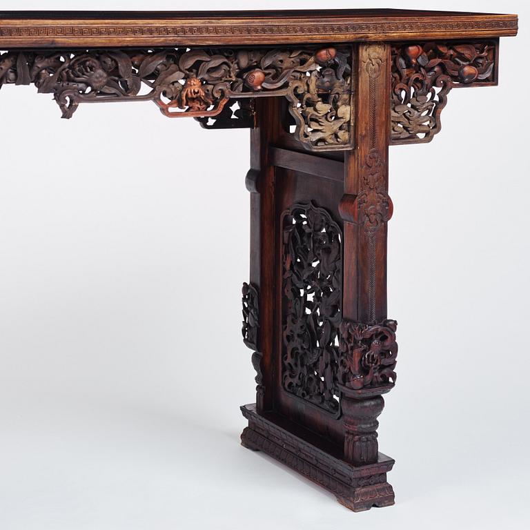 A massive zitan recessed-leg long table 'Jiaotousun Qiotouan', Qing dynasty, 19th century.